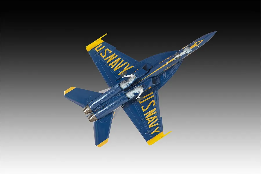 A bottom-view studio shot of a completed Revell 1/72 scale Blue Angels F/A-18 Hornet plastic model aircraft, showing the blue and yellow livery.