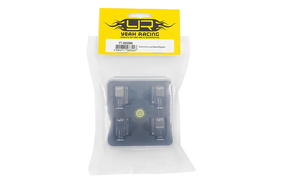 Yeah Racing Aluminium Level Board System (YT-0252BK) in original retail packaging, featuring four black metal leveling blocks and a small spirit level.
