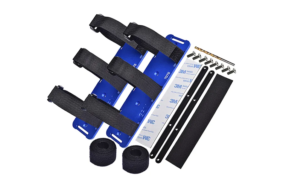 GPM Racing blue aluminium battery hold-down set including plates, velcro straps, screws, drill bit, and adhesive strips.