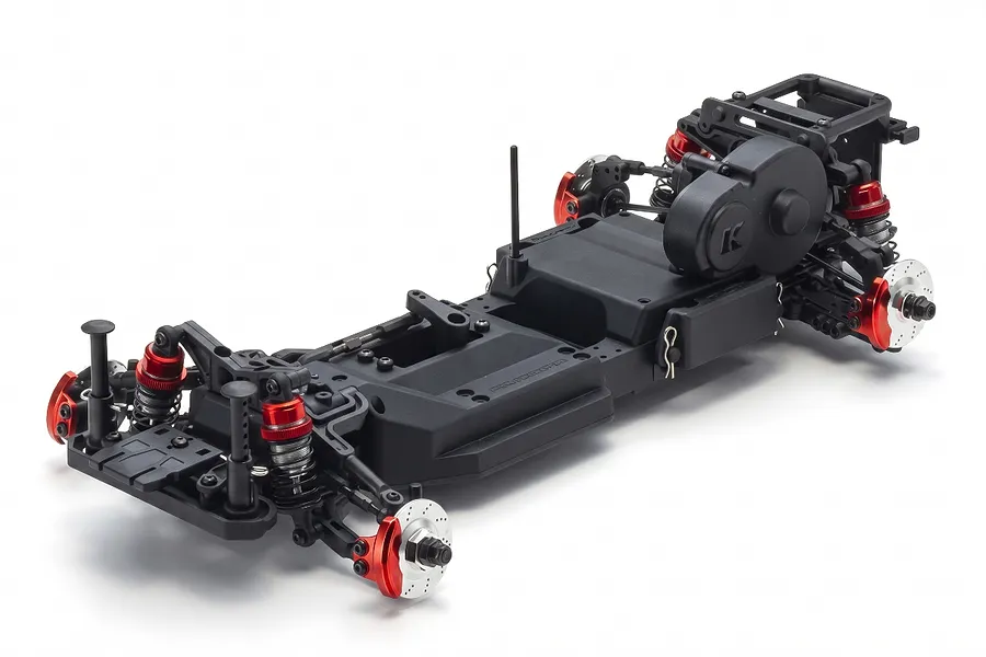 A studio shot of the Kyosho Fazer D2 RC drift car chassis, featuring a black plastic frame with red anodized aluminum suspension components.