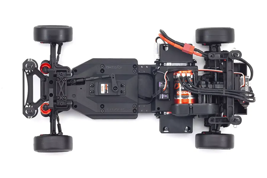 Top-down view of the Kyosho Fazer D2 RC drift car chassis showing the motor, servo, and drivetrain components on a white background.