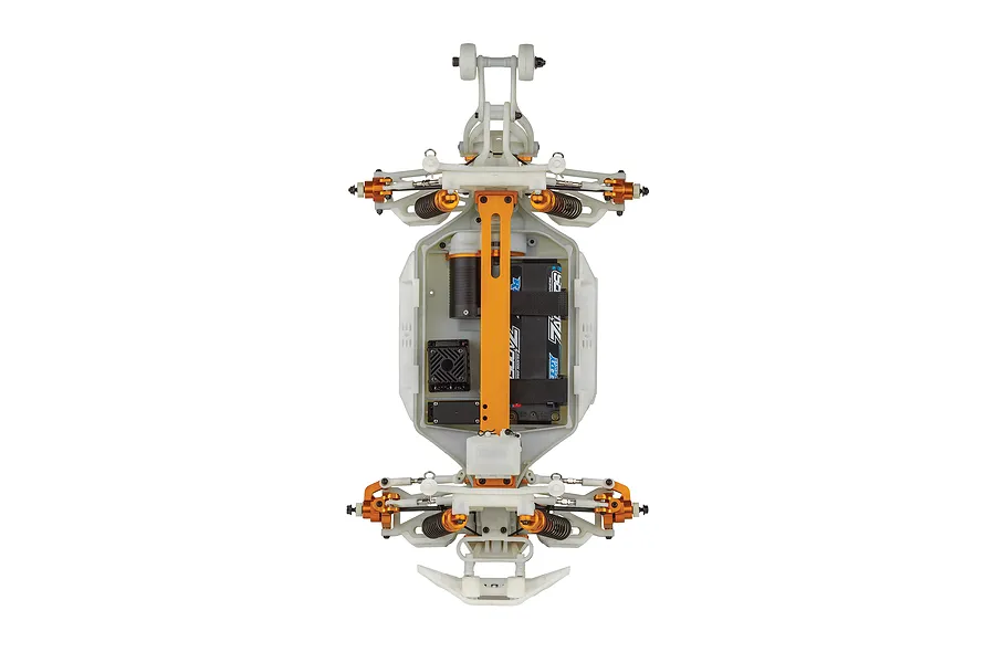 Top-down view of a Team Associated Rival MT10 RC monster truck chassis showing the white plastic frame, orange anodized aluminum parts, and electronics.