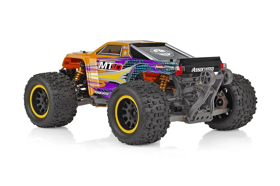 Rear three-quarter view of the Team Associated Rival MT10 monster truck with orange and purple bodywork, black wheels, and a rear wheelie bar.