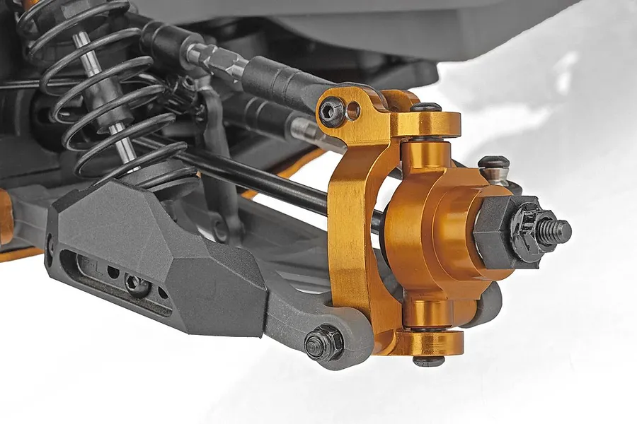 Close-up of the front suspension and steering knuckle assembly on a Team Associated RC monster truck.