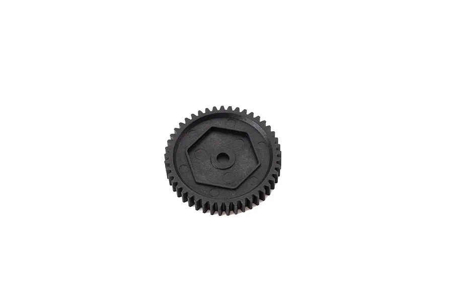 A black plastic spur gear for an RC vehicle, featuring a central hexagonal mounting point and a circular hole.