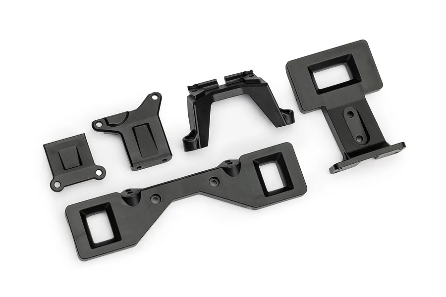 A set of black plastic Traxxas clipless body latch components arranged on a white background.