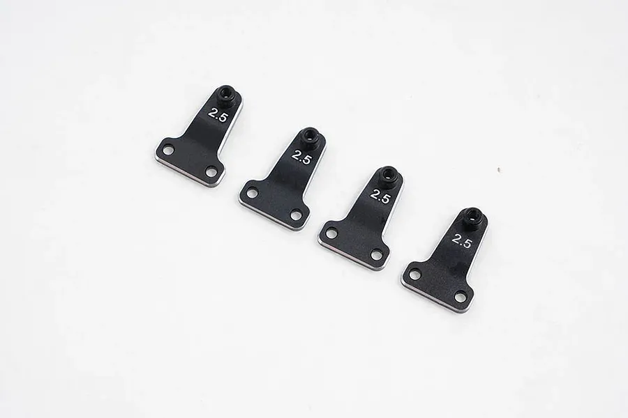 Four black metal shock offset adjustor brackets with the number 2.5 printed on each, arranged in a row on a white background.