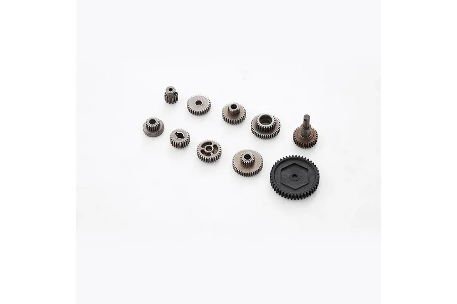 A set of various metal and plastic gears for an RC differential, arranged on a white background.