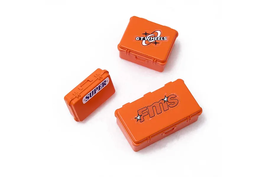 Three orange miniature storage boxes of varying sizes with decals, isolated on a white background.