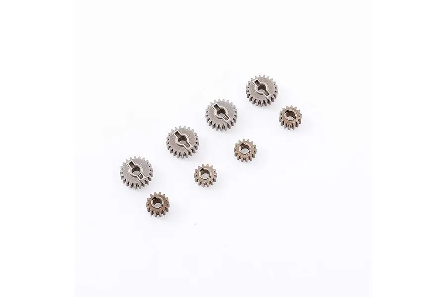 A set of seven small metal portal axle gears of varying sizes arranged on a white background.