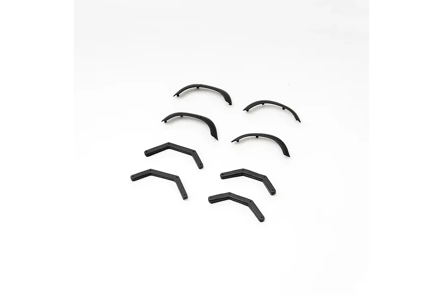 A set of black plastic RC fender flares and corner trim pieces arranged on a white background.