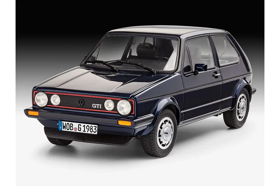 A studio shot of a completed 1/24 scale Revell model kit of a dark blue 1983 Volkswagen Golf GTI Pirelli edition.