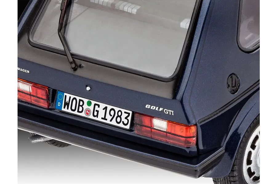 Close-up of the rear of a dark blue 1/24 scale model VW Golf GTI, showing the license plate, taillights, and rear window wiper.