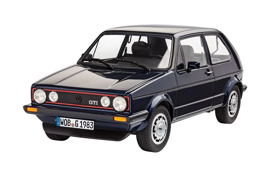 A 1/24 scale plastic model of a dark blue 1983 VW Golf GTI Pirelli edition, featuring detailed wheels, headlights, and a German license plate.