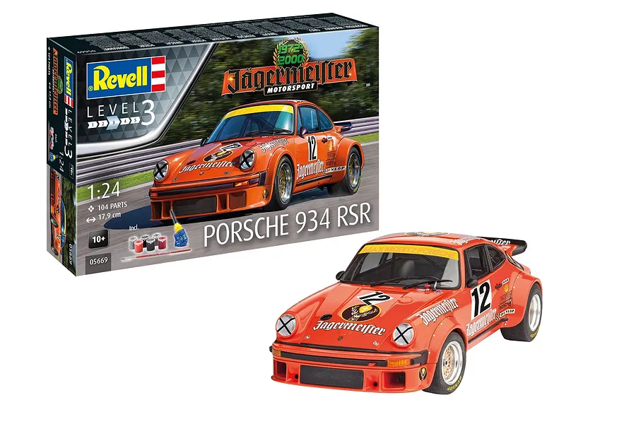 Revell 1/24 scale Porsche 934 RSR Jägermeister model kit box and a fully assembled, painted orange race car model.