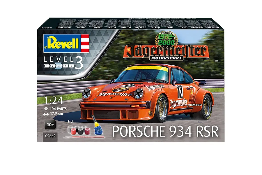 Revell 1/24 scale Porsche 934 RSR Jägermeister model kit box showing the orange race car on a track with included paints, glue, and brush.