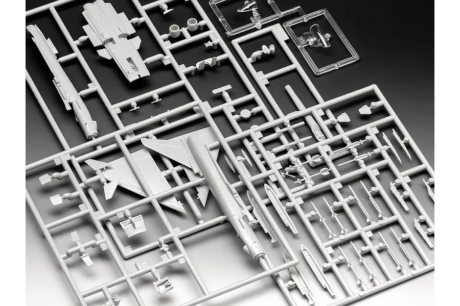 Grey plastic model kit sprues for a 1/144 scale Eurofighter Typhoon aircraft, showing wings, fuselage, and weapon components on a gradient background.