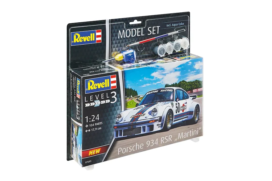 Revell 1/24 scale Porsche 934 RSR Martini plastic model starter kit in blister packaging with included paint, glue, and brush.