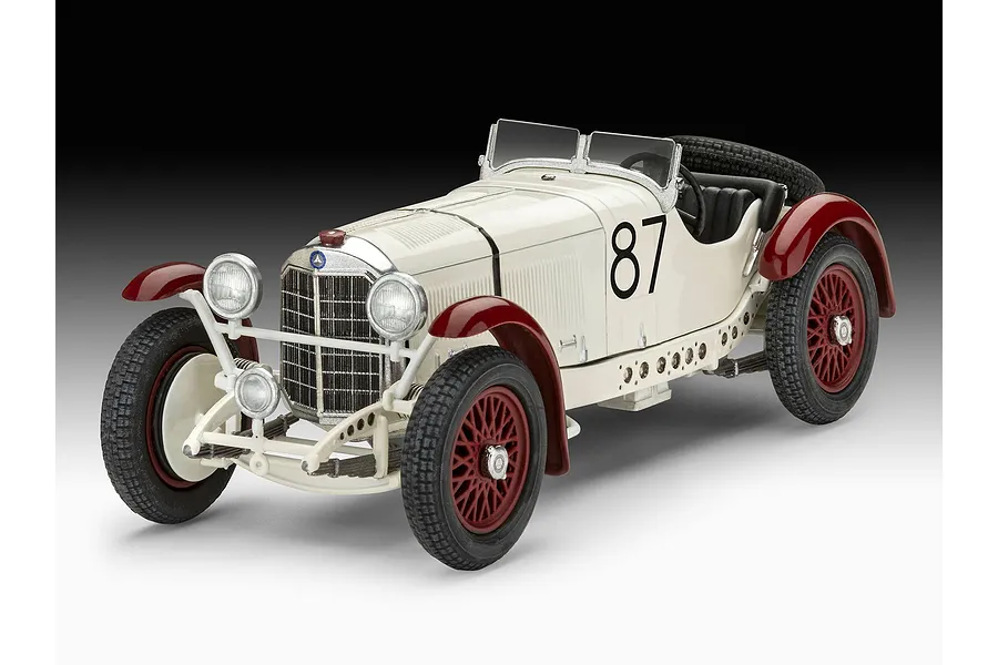 A studio shot of a 1/32 scale Revell Mercedes-Benz SSKL model car, featuring a white body with red fenders, wire wheels, and the number 87 on the side.