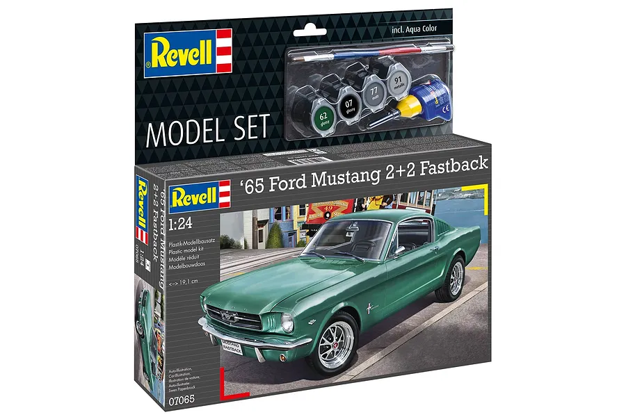 Revell 1/24 scale 1965 Ford Mustang 2+2 Fastback model kit box showing a green car illustration, paint pots, glue, and a paintbrush.