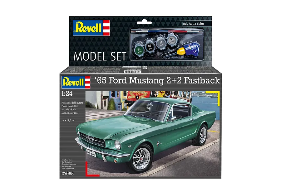 Revell 1/24 scale 1965 Ford Mustang 2+2 Fastback plastic model starter kit box, featuring a green car illustration and included paint and glue.