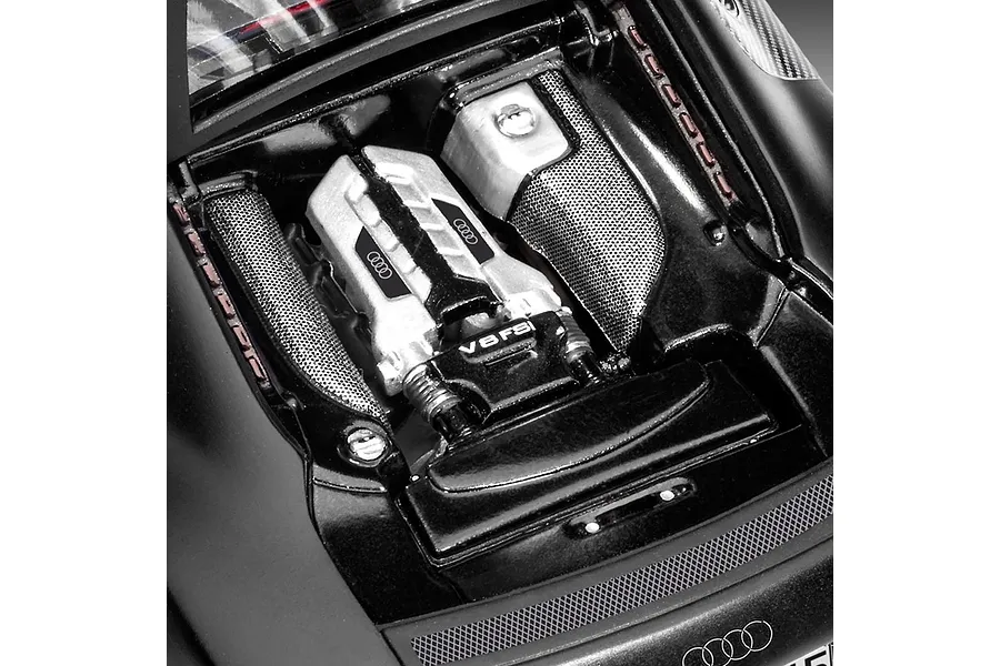 Close-up of the detailed V8 FSI engine bay of a 1/24 scale Audi R8 plastic model car kit.