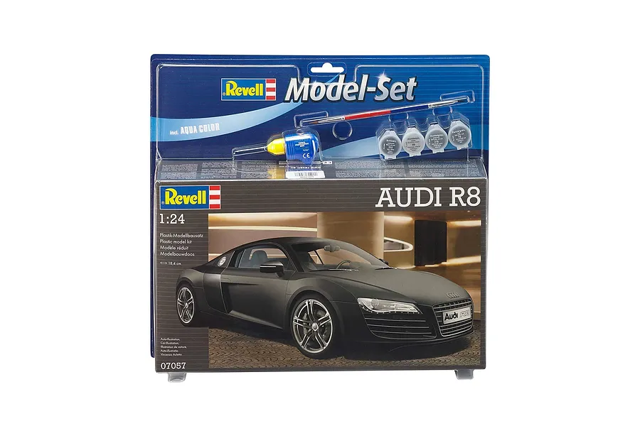 Revell 1/24 scale Audi R8 plastic model kit in original blister packaging, including paint, glue, and a brush.