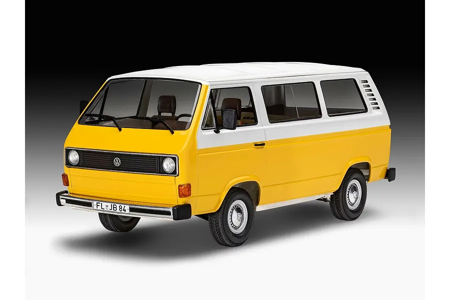 A completed 1/24 scale Revell plastic model kit of a yellow and white Volkswagen T3 bus, shown from a front three-quarter angle.