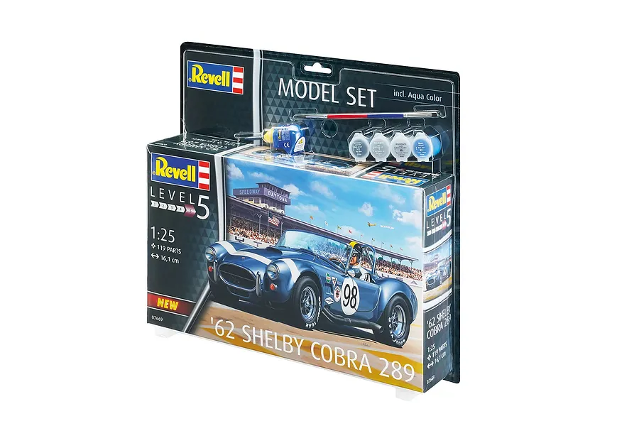 Revell 1/25 scale '62 Shelby Cobra 289 model kit in blister packaging, including paints, glue, and a brush.