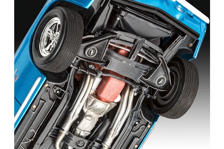 Underside view of a 1/25 scale Revell 1969 Chevy Camaro Yenko model car showing the chassis, engine block, and suspension details.