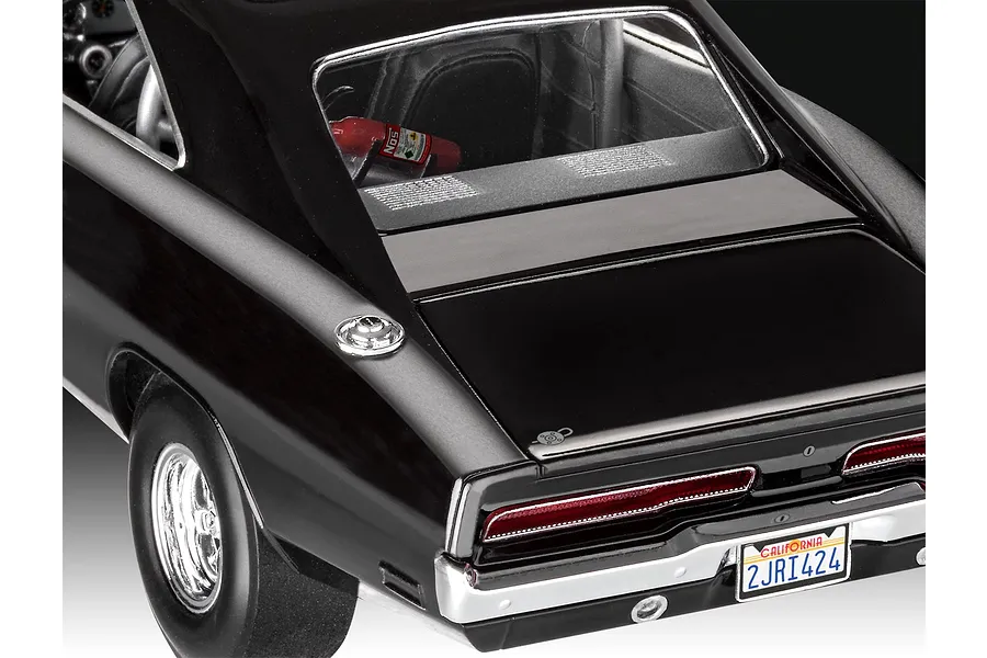 Rear view of a 1/25 scale black 1970 Dodge Charger model car showing the trunk, taillights, California license plate, and a NOS bottle inside.