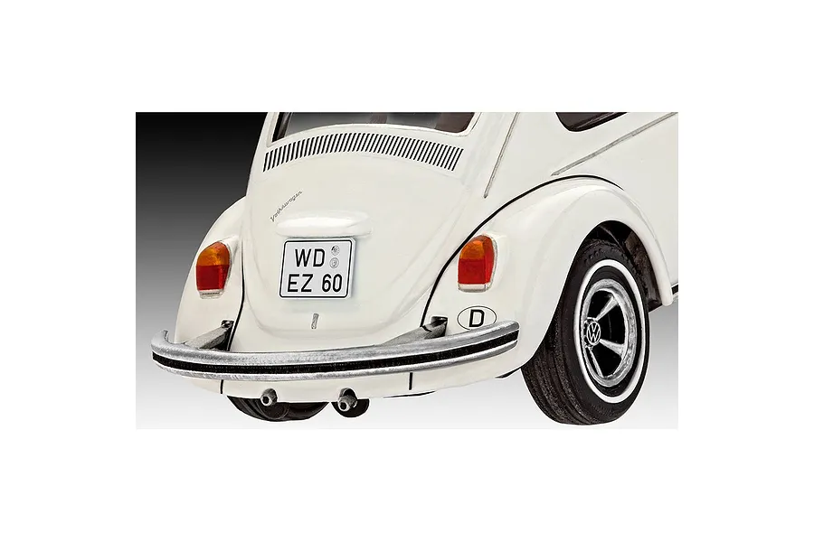 Rear view of a white Revell 1/32 scale Volkswagen Beetle model car showing the bumper, taillights, and German license plate.