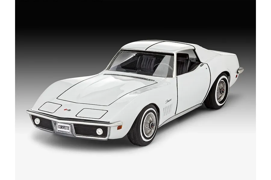 A white Revell 1/32 scale Corvette C3 plastic model car, shown from a front three-quarter angle against a gradient background.