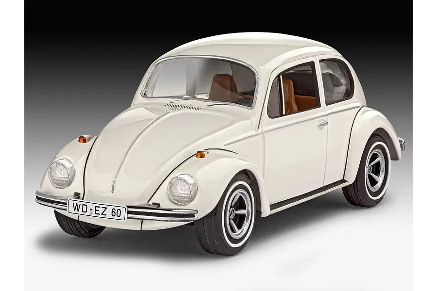A studio shot of a completed 1/32 scale Revell VW Beetle plastic model car in white with brown interior, shown from a front three-quarter angle.