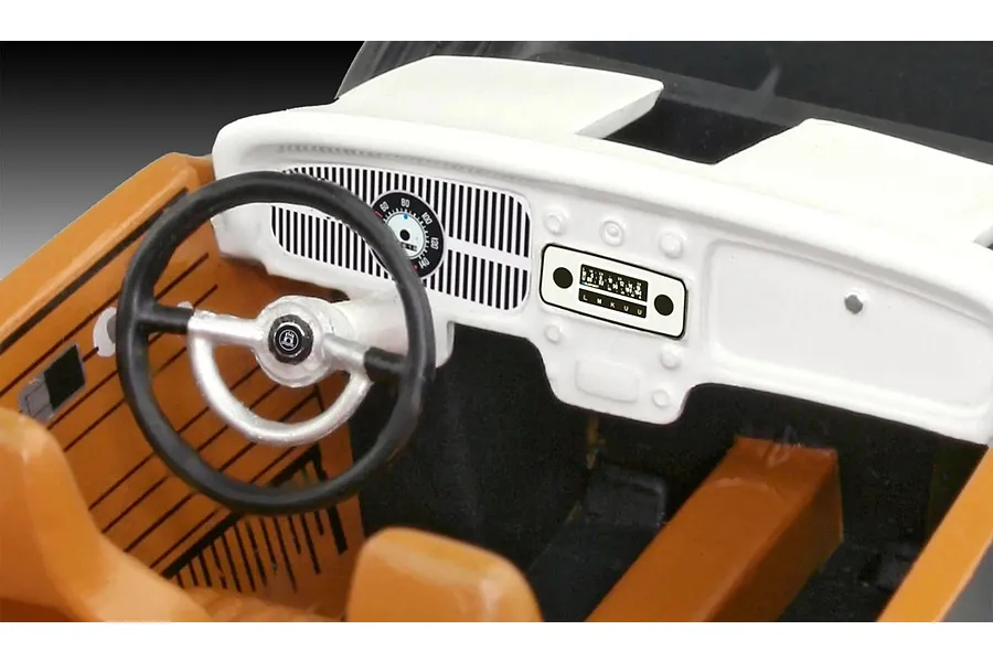 Close-up of the interior dashboard and steering wheel of a 1/32 scale VW Beetle model kit.