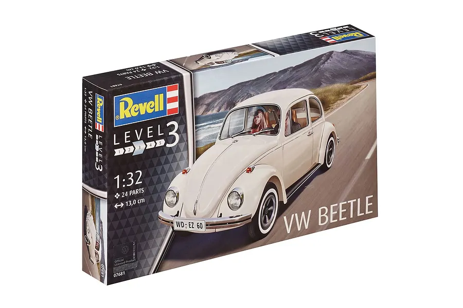 Revell 1/32 scale VW Beetle plastic model kit box featuring an illustration of a cream-colored vintage Volkswagen Beetle driving along a coastal road.