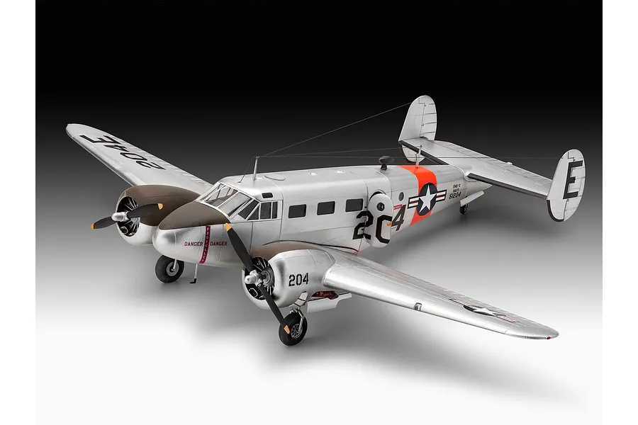 A completed 1/48 scale model of a silver Beechcraft Model 18 aircraft with US Navy markings, displayed against a gradient background.