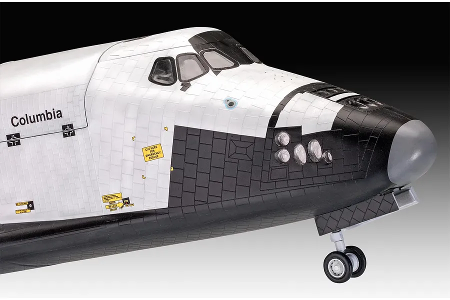 Close-up of the nose section of a Revell 1/72 scale Space Shuttle Columbia plastic model kit, showing detailed tile patterns and landing gear.