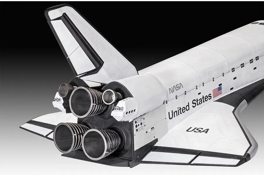 A close-up view of the rear section of a Revell 1/72 scale Space Shuttle model, showing the engine nozzles, vertical stabilizer, and NASA branding.