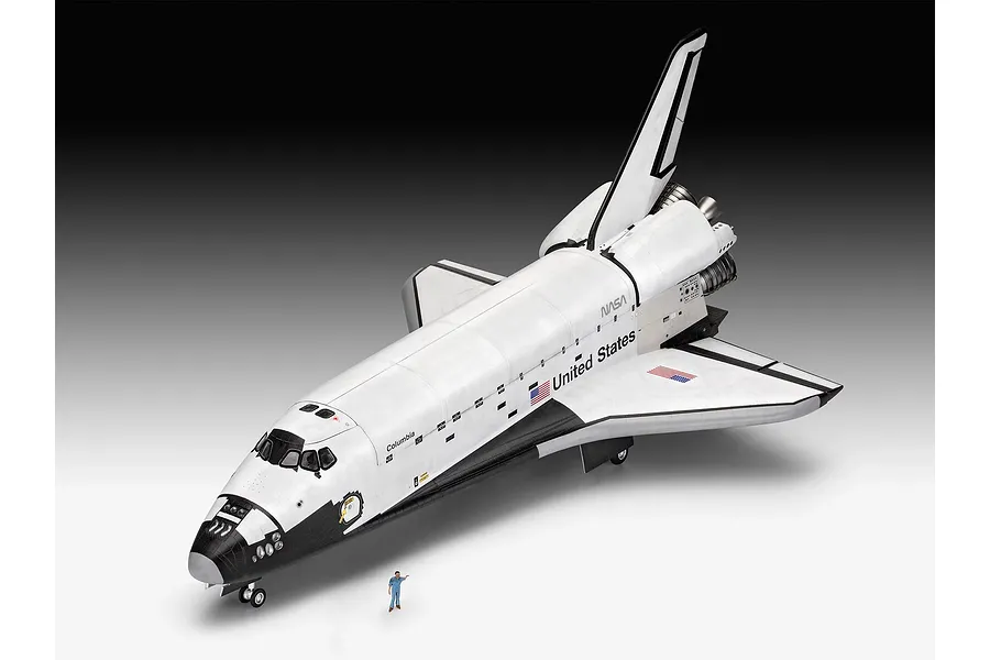 A completed 1/72 scale plastic model of the Space Shuttle Columbia, featuring NASA branding and a small scale figure standing in front for size comparison.