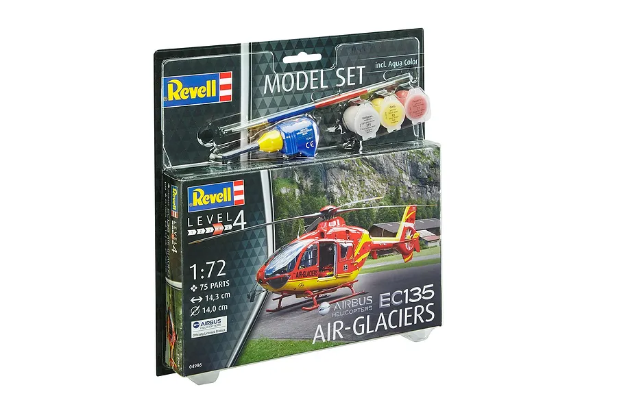 Revell 1/72 scale Airbus EC135 Air-Glaciers helicopter model starter kit in blister packaging with paints, glue, and brush.