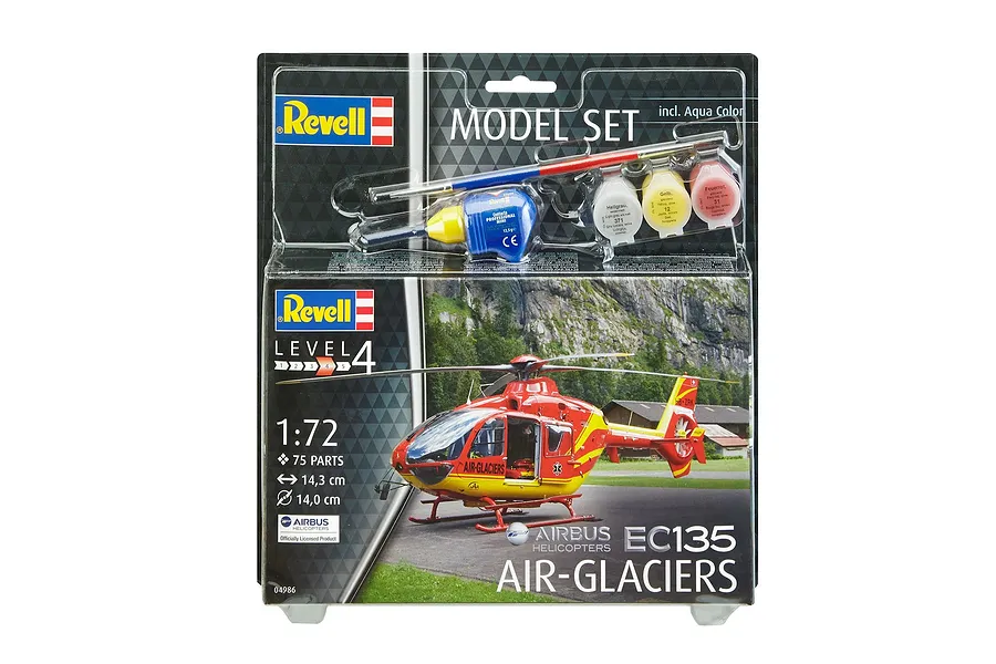 Revell 1/72 scale Airbus EC135 Air-Glaciers helicopter model kit in blister packaging with included paints, glue, and brush.