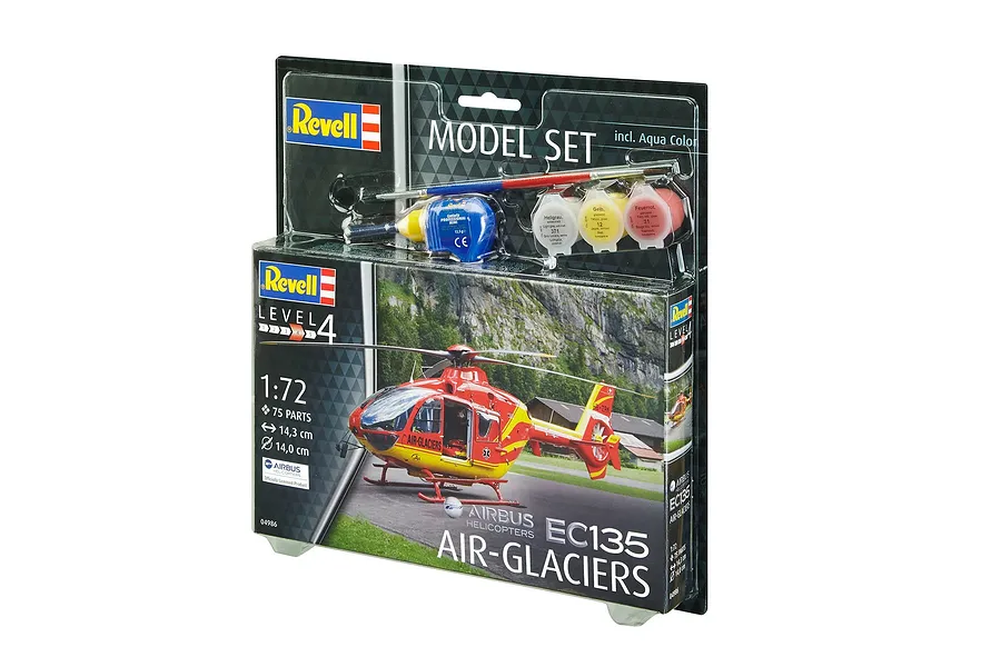 Revell 1/72 scale Airbus EC135 Air-Glaciers helicopter model starter kit in blister packaging with paints, glue, and brush.