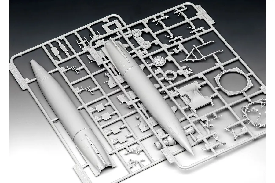 A grey plastic sprue containing parts for a 1/72 scale A4-V2 rocket model kit, including the rocket body and various support components.