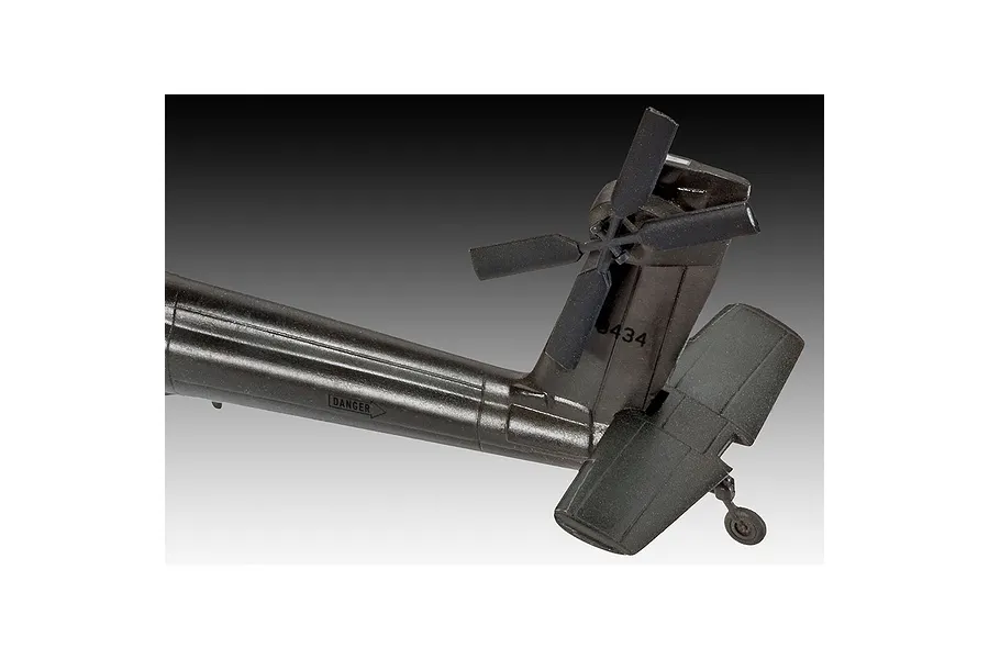 Close-up of the tail section of a Revell 1/100 scale AH-64A Apache plastic model helicopter, showing the tail rotor and horizontal stabilizer.
