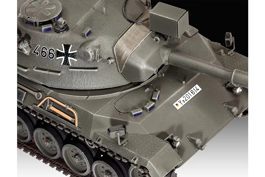 Close-up of a 1/35 scale plastic model of a Leopard 1 tank, featuring olive green paint, German military markings, and detailed turret and hull components.