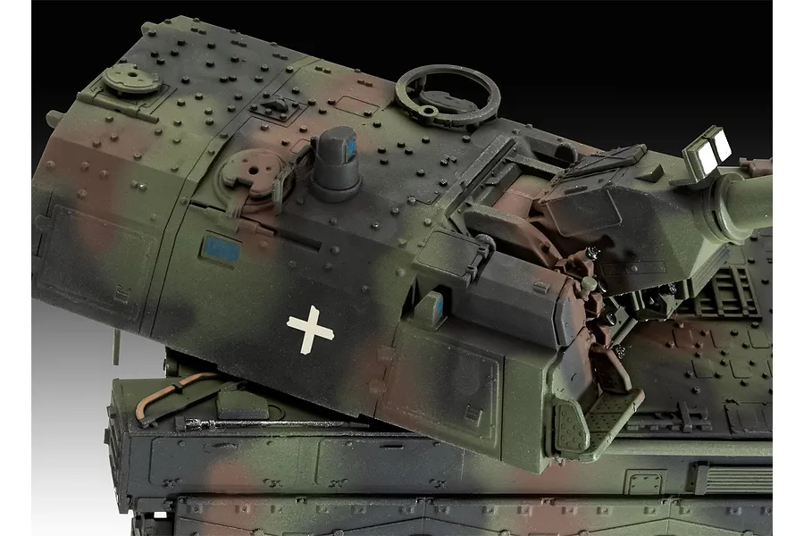 A close-up, high-angle view of a painted 1/72 scale Panzerhaubitze 2000 model tank showing the turret and upper hull with camouflage paint.