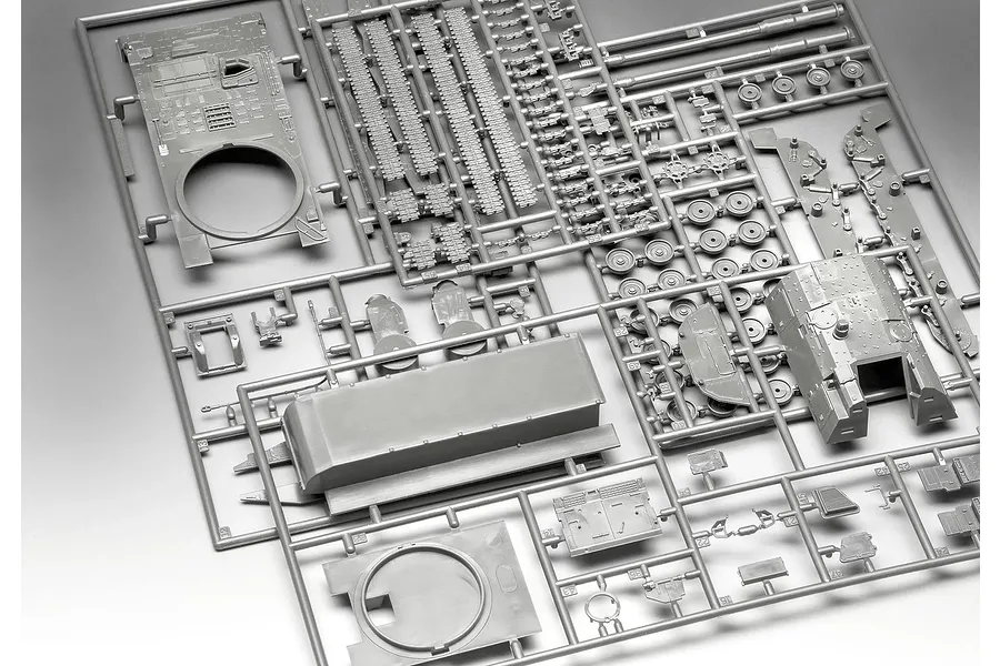 A grey plastic sprue containing various unpainted parts for a 1/72 scale Panzerhaubitze 2000 model kit, including hull, turret, and track sections.