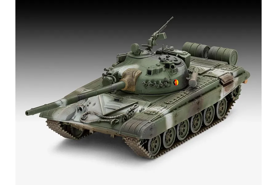 A fully assembled and painted 1/72 scale plastic model of a T-72 M1 tank, featuring a green camouflage paint scheme and East German insignia.