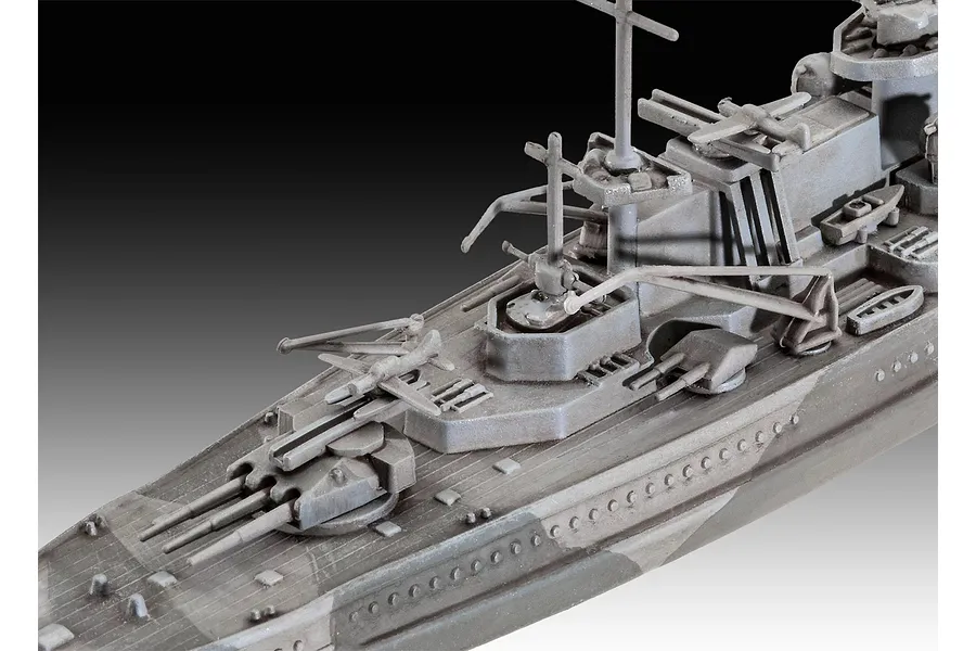 Close-up of the deck of a 1/1200 scale Revell Gneisenau battleship model, showing grey plastic turrets, masts, and deck details.